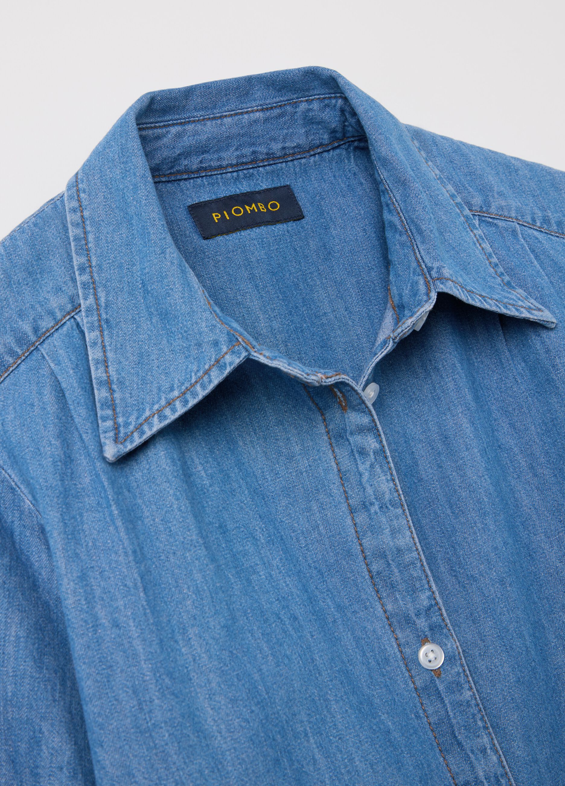 Blue denim shirt with knot