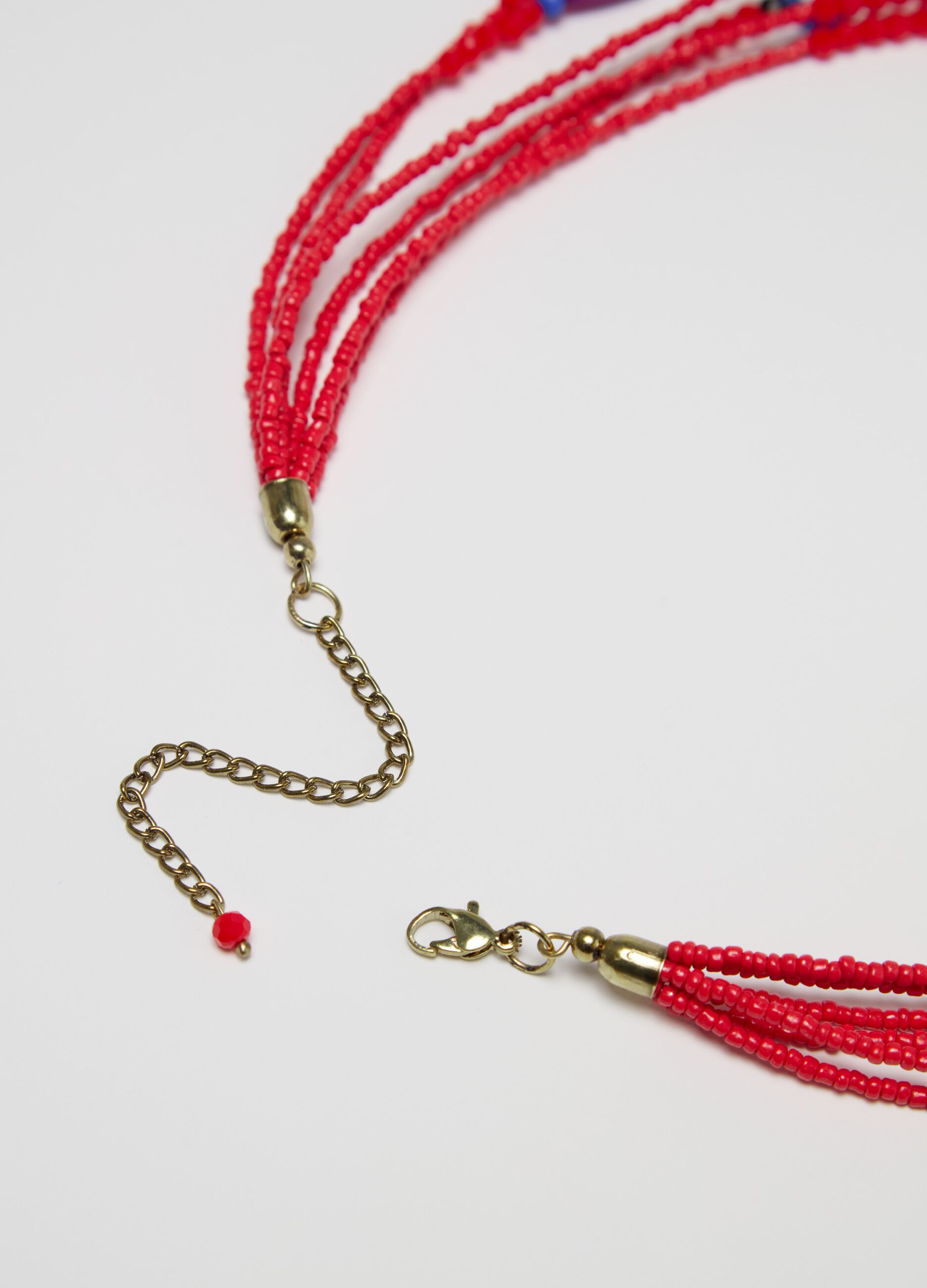 Collar multicadenas con cuentas y borla