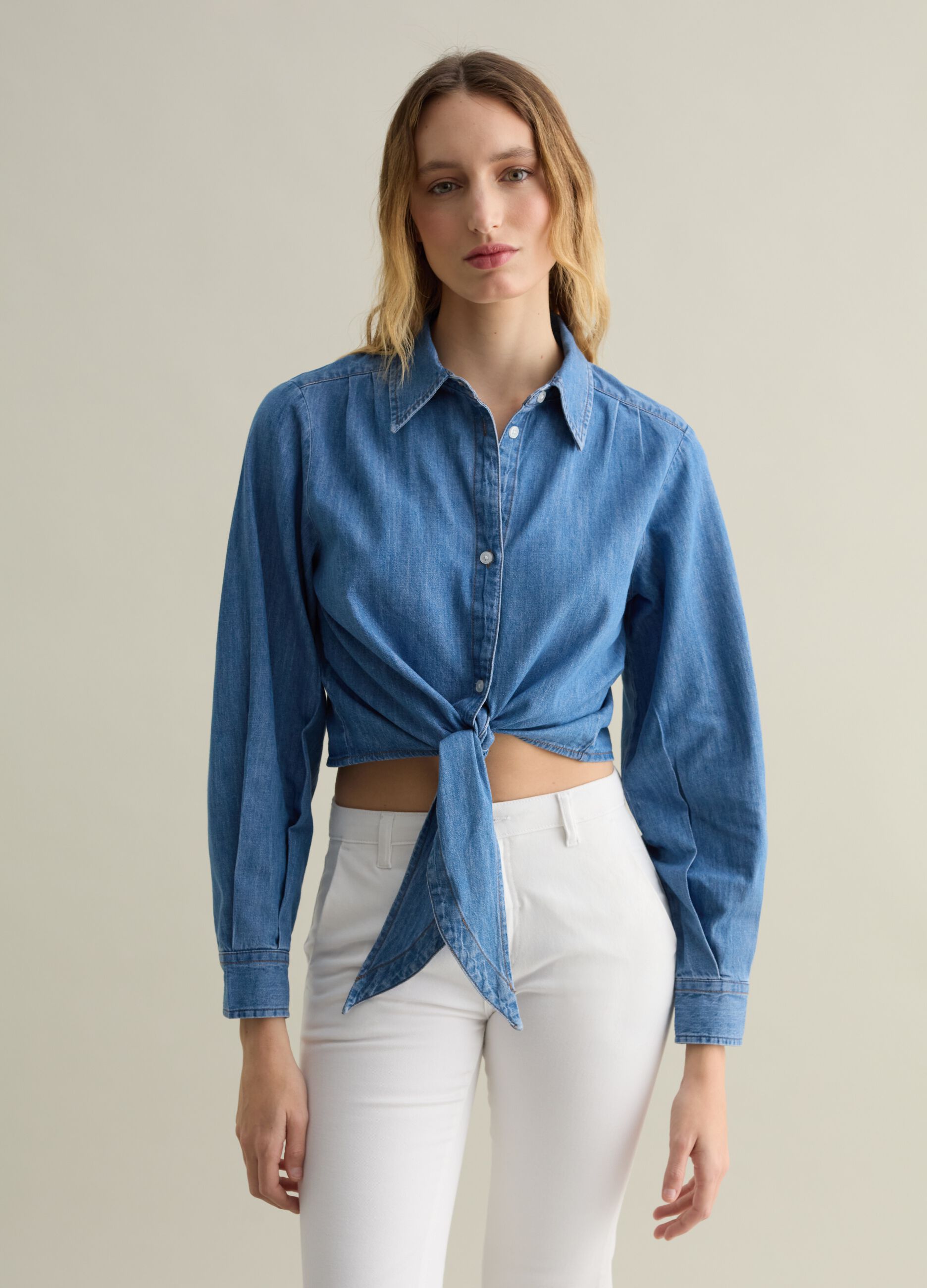 Blue denim shirt with knot