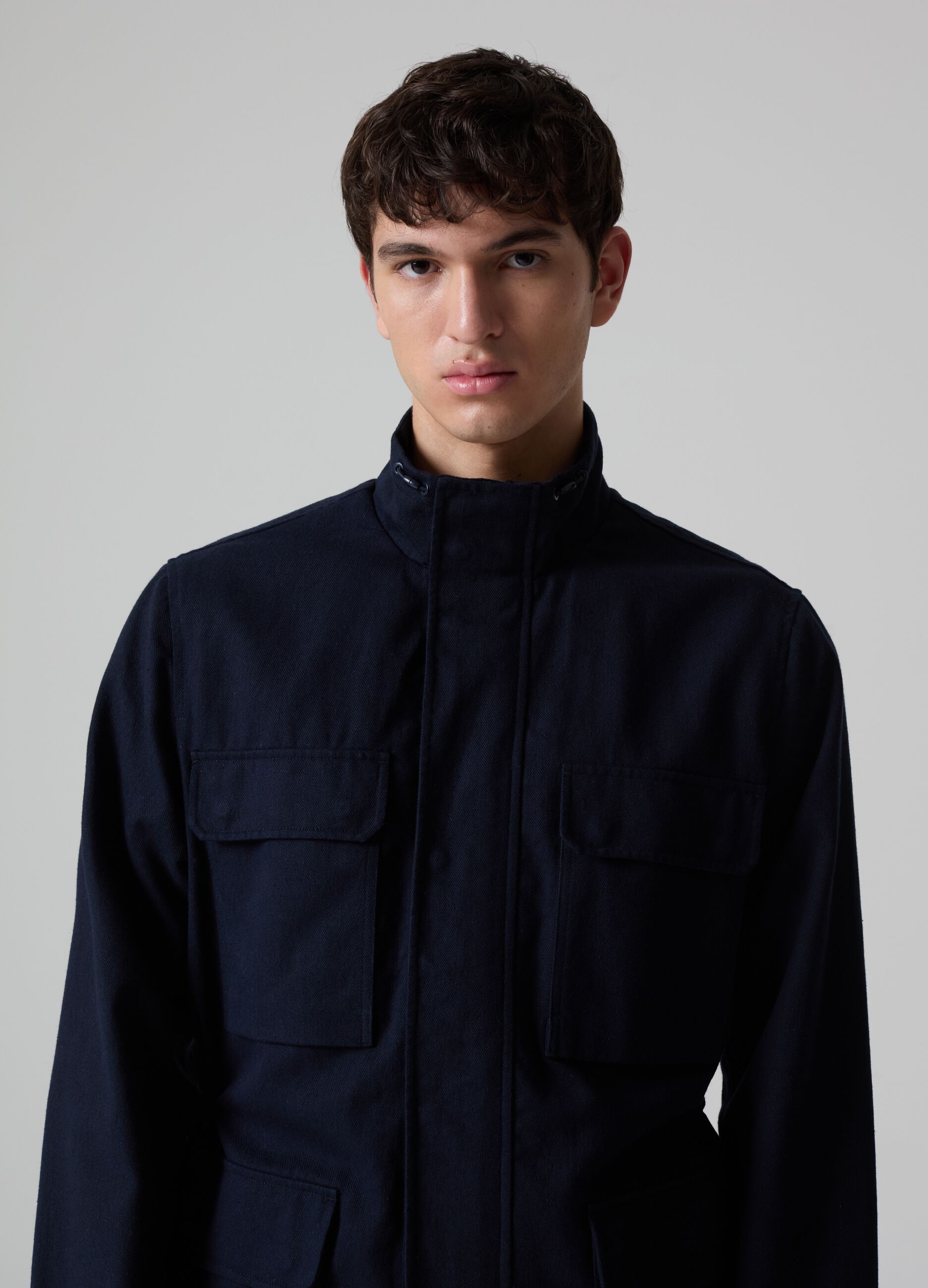 Contemporary short jacket with high neck