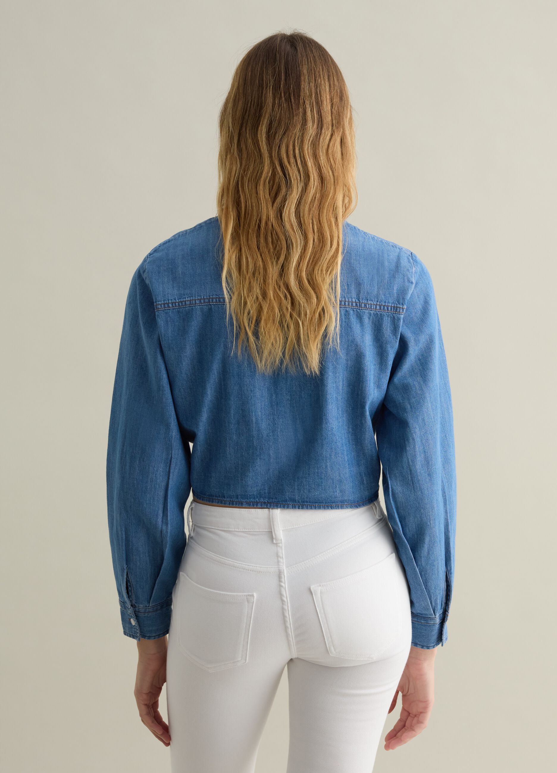Blue denim shirt with knot