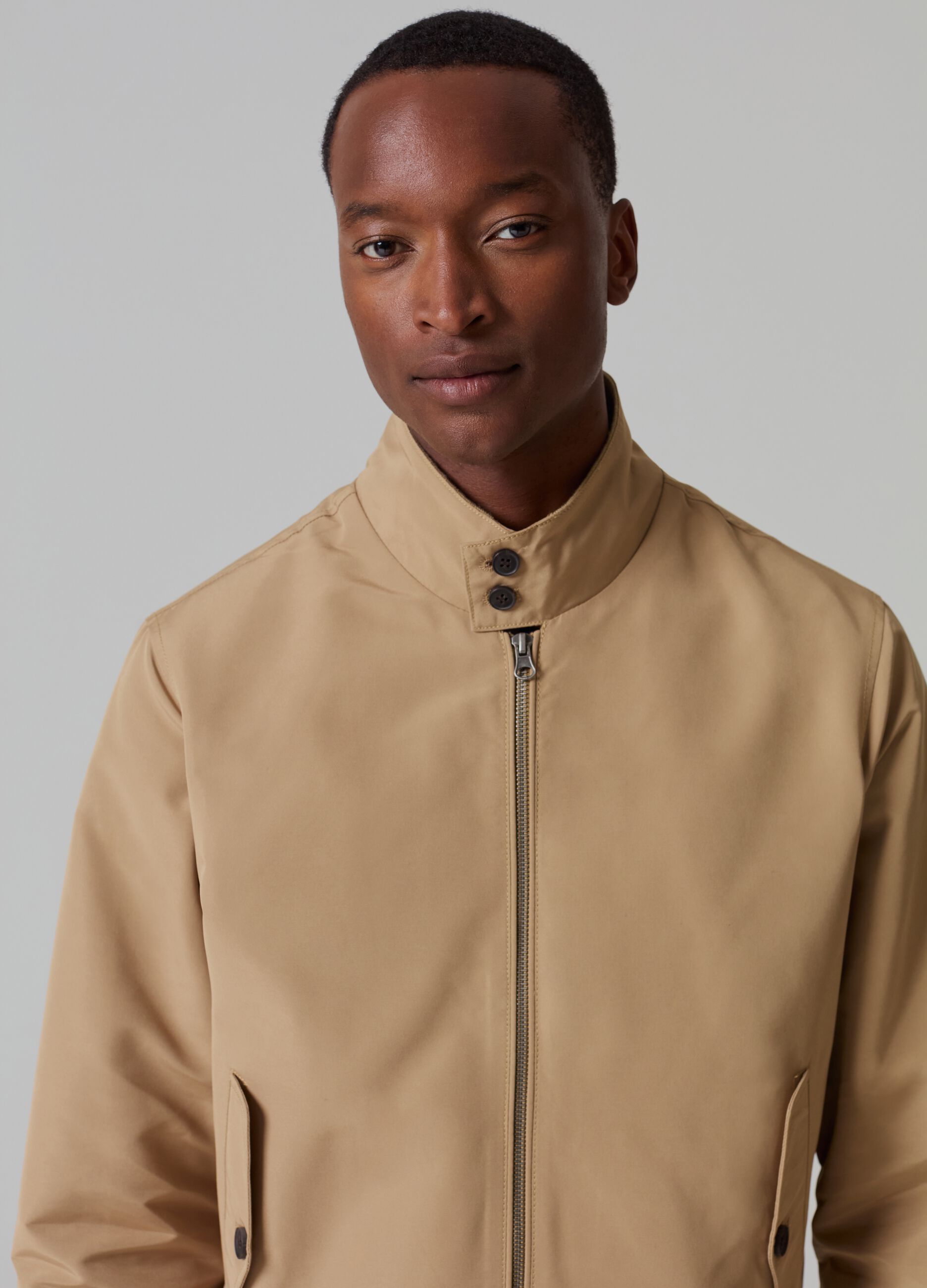Full-zip bomber jacket with high neck and buttons