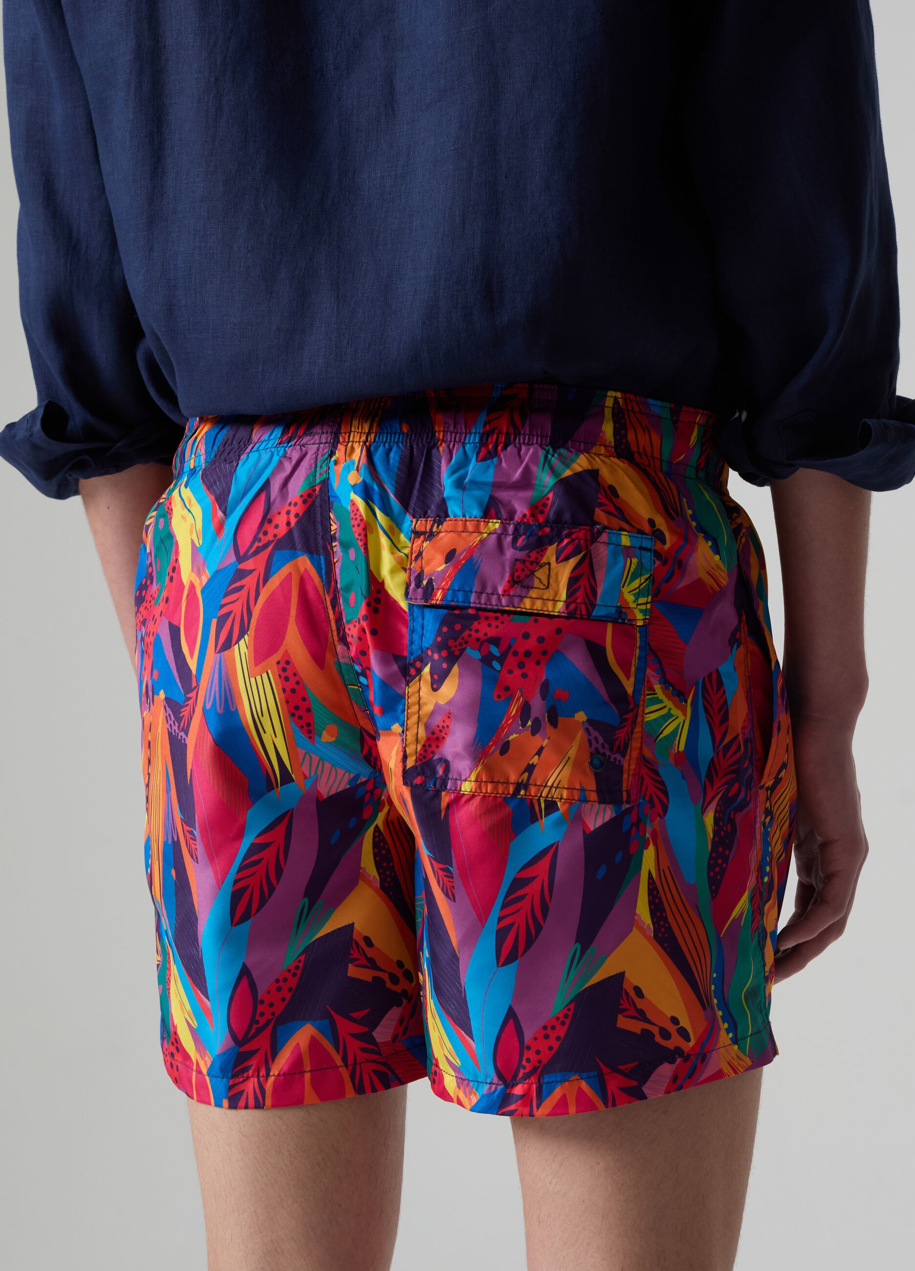 Bermuda swim shorts with tropical print