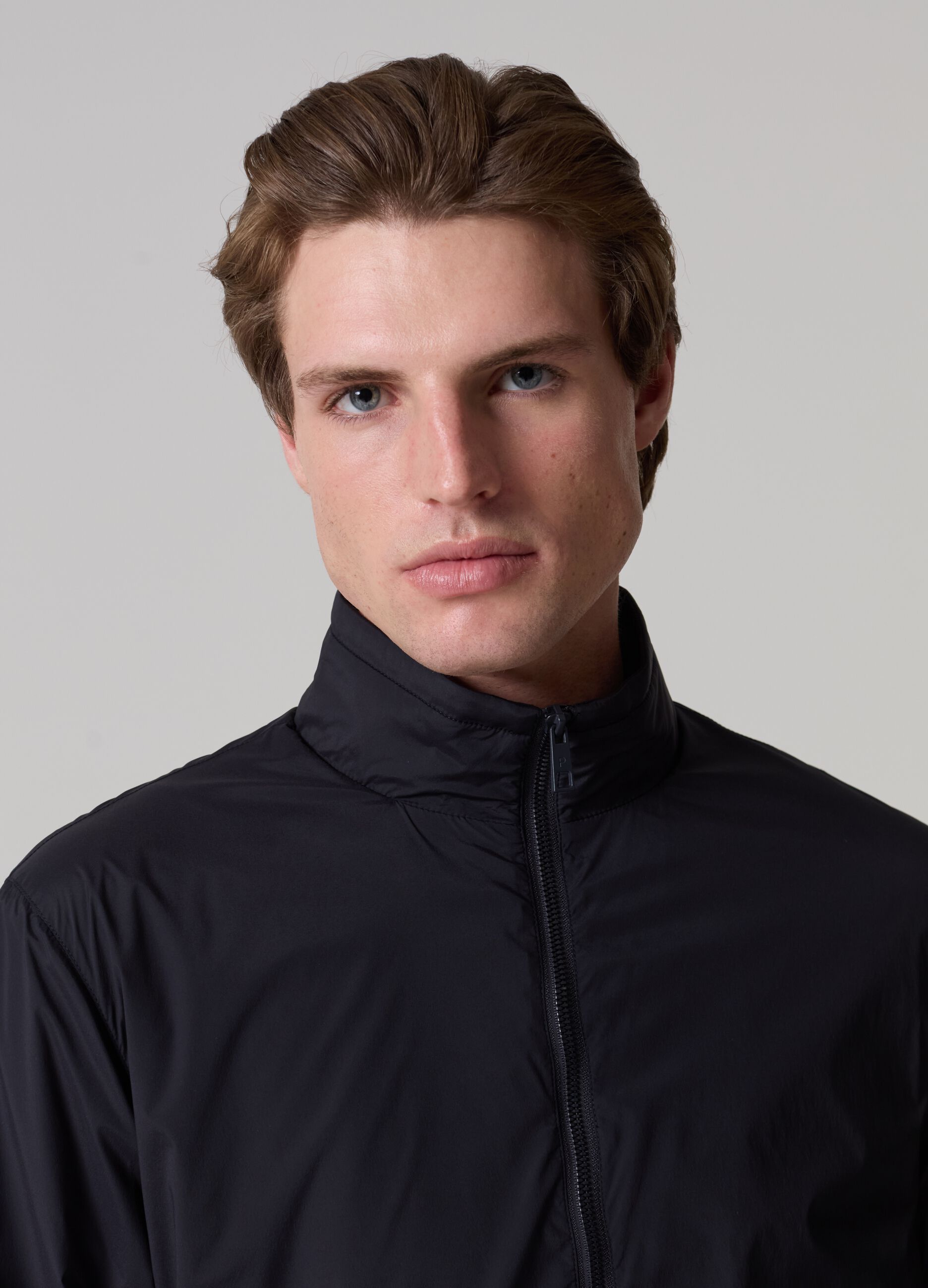 Contemporary short jacket with high neck